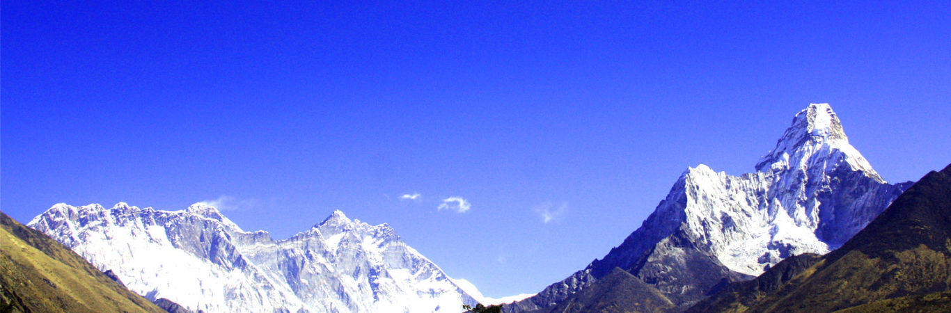 Foreground view of Ama Dablam and background view of Everest and surrounding peaks