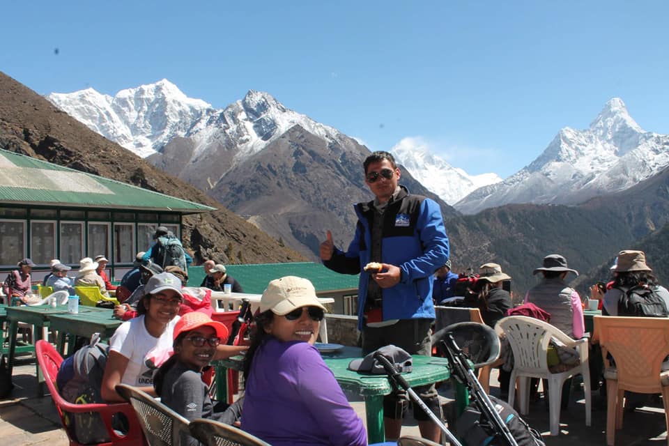 guide Madan Ghale with guests having lunch 