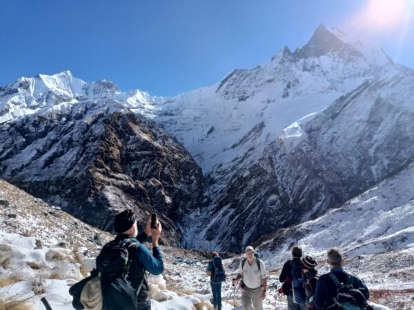 Trekkers are enjoying the view of Annapurna Massif