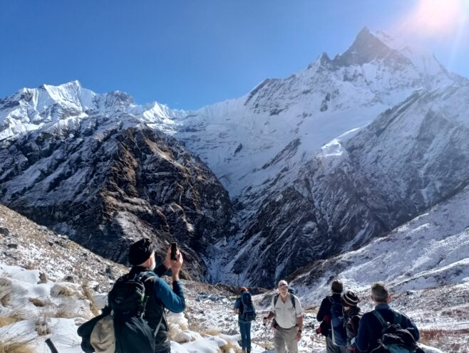 Short Annapurna Base Camp Trek – Fly Kathmandu to Pokhara & Back 3 Trekkers are enjoying the view of Annapurna Massif