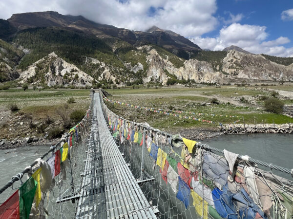 The suspension bridge to Milarepa Cave