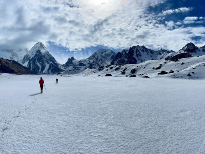 Kanchenjunga Circuit Trek - 18 Days 8 Trekker walking on a snowy field in Kanchenjunga Base Camp