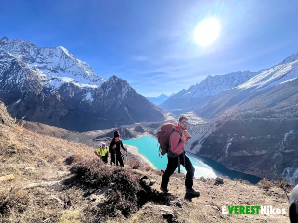 Spanish traveler trekking the Manaslu Circuit Trek with stunning mountain views in Nepal