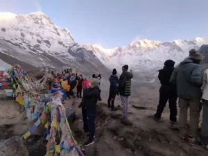 Annapurna Base Camp Trek Difficulty: How Challenging Is the ABC Trek? 4 Trekkers enjoying sunrise views at Annapurna Base Camp trek.