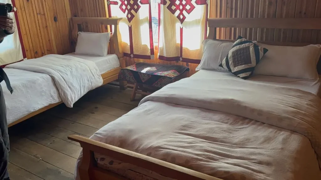 Comfortable teahouse room with wooden interior at Annapurna Base Camp