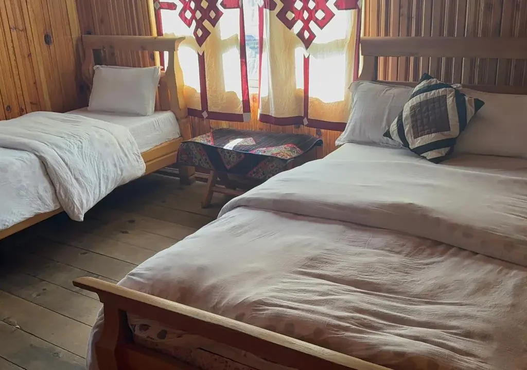 Comfortable teahouse room with wooden interior at Annapurna Base Camp