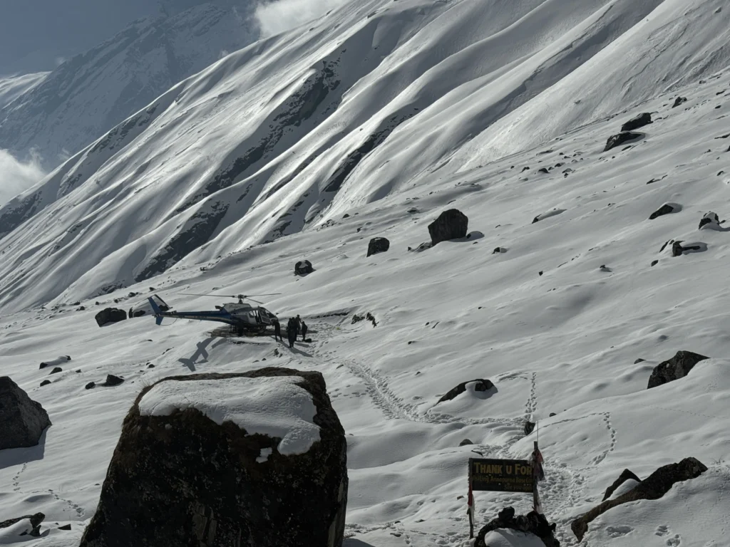 Helicopter tours in nepal - Helicopter landing on a annapurna base camp.